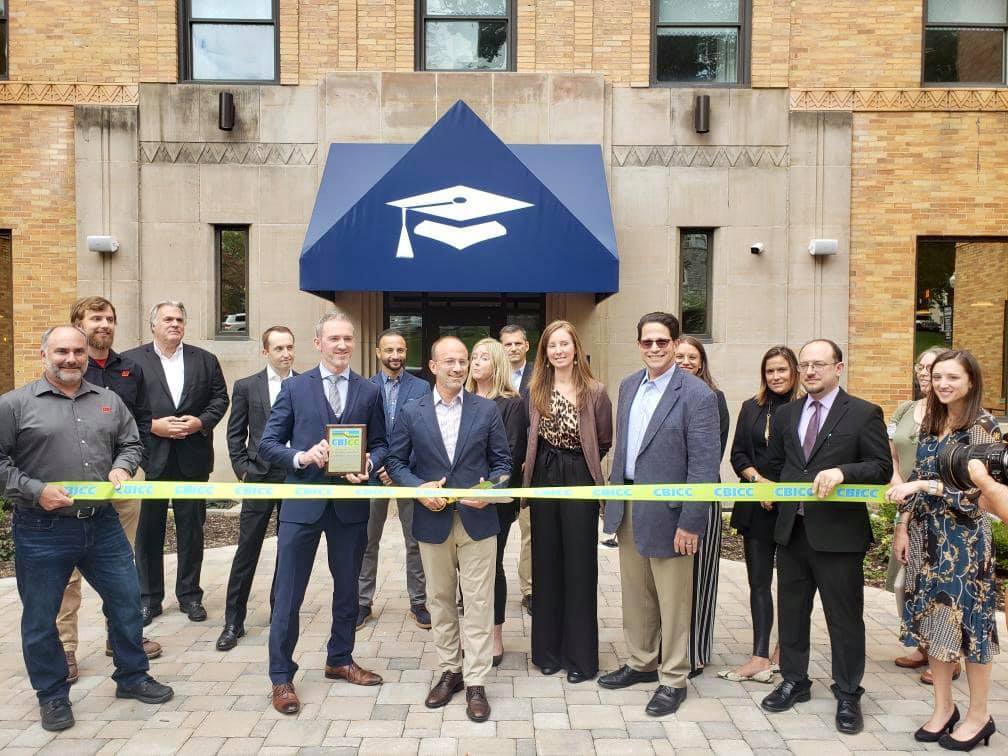Scholar Hotel Team Cuts CBICC Ribbon at Recently Renovated, Historic Building